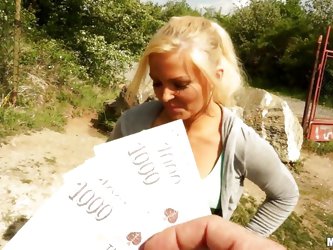 Blonde with amazing body is being given money to show her breasts to the camera. She's letting him see them, but not touch them, at least for now