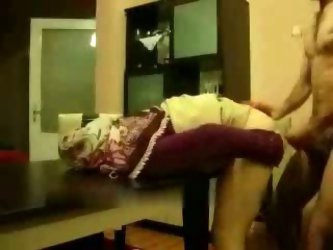 My friend is Arabian and has a cute 20 years old Arabian wife. In this homemade video his wife bends over the dining table and gets her soaking pussy 